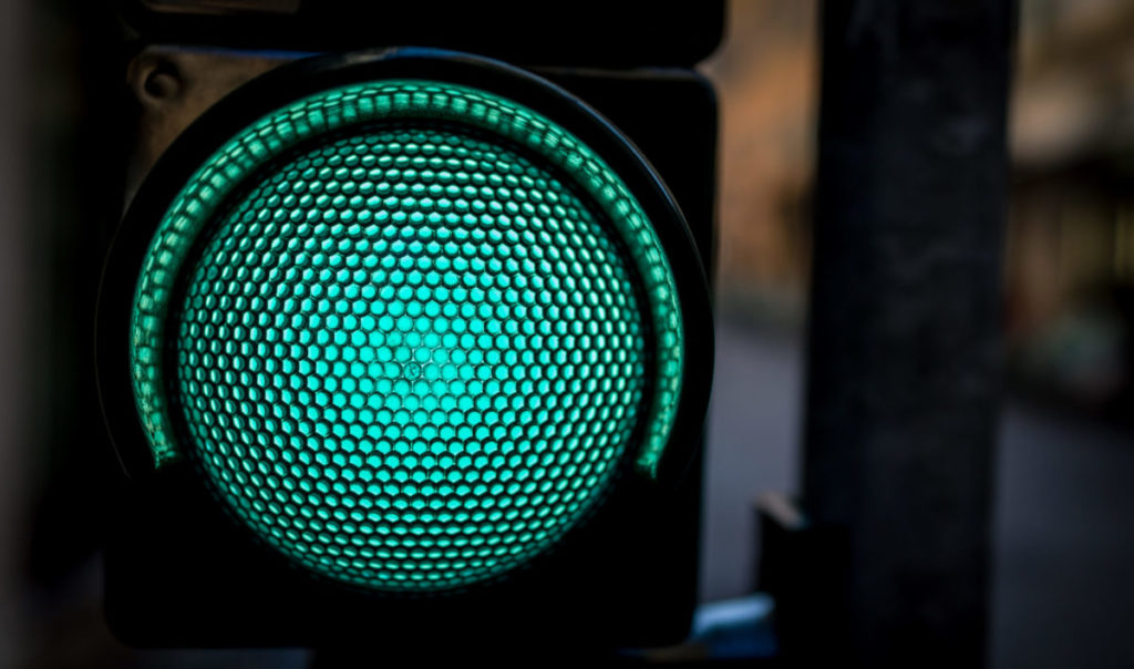 Closed up shot of green traffic light as ready to go concept