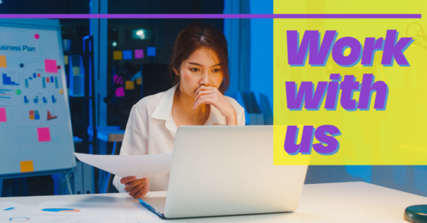 A person sits at a computer holding a paper and thinking. Text reads: Work with us.