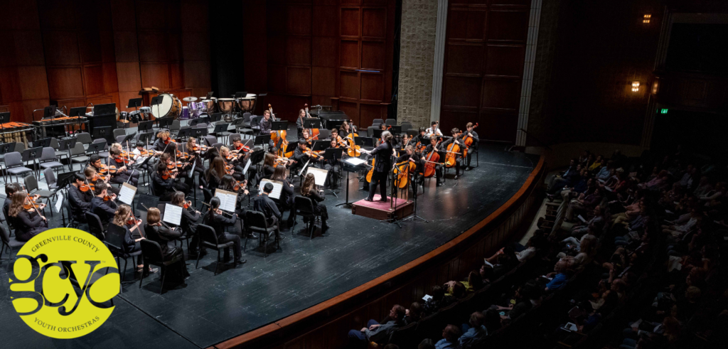 An action picture of the Greenville County Youth Orchestra, on stage at the Peace Center.