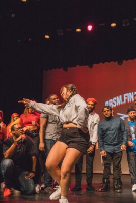 K-Pop Dance instructor Stacey Styce performs for an onstage crowd.