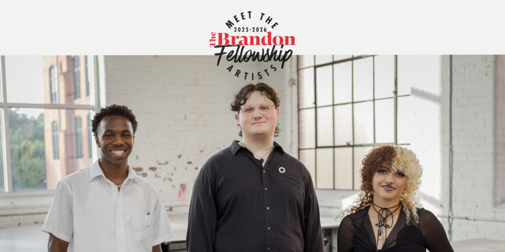 Group photo of Joel Houston, Alexander Rouse, and Bella Bishara standing in a bright, open studio with white walls and large windows.