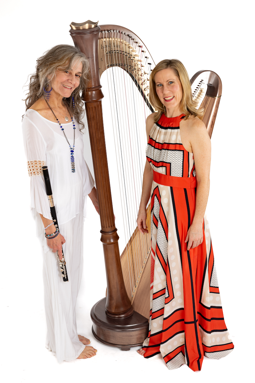 Musicians Kate Steinbeck, flute, and Jessica Schaeffer, harp, pose with their instruments.