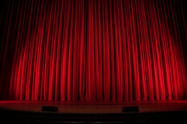 closed theatrical red stage curtain