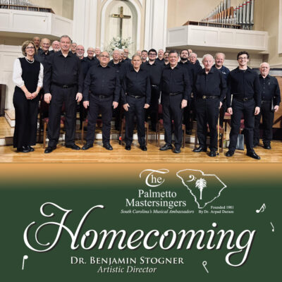 A choir of men in concert black prepare to sing in a church setting.