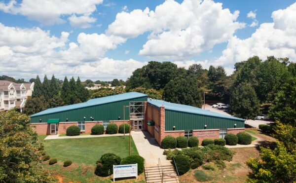 Phyllis Wheatley Community Center, a brick building with a green split peaked roof