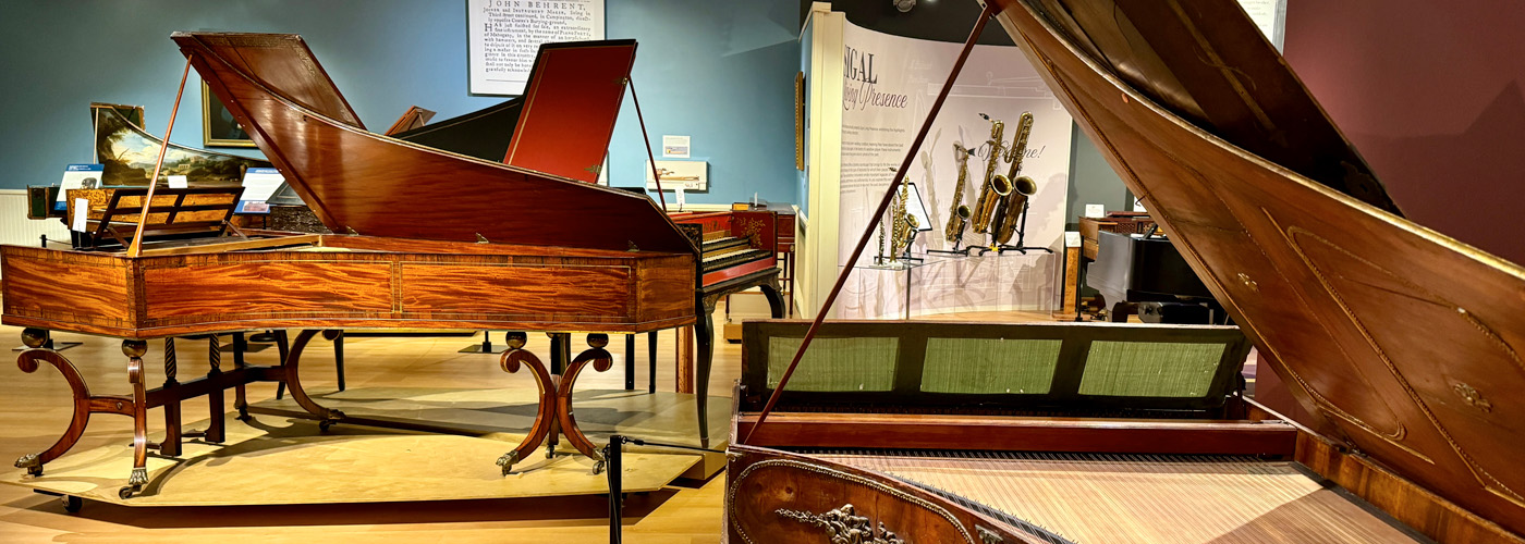 antique grand pianos in a music museum