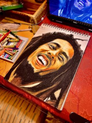 An oil pastel drawing of Bob Marley with his signature dreadlocks.