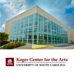 Exterior shot of the Koger Center for the arts glass facade on a bright partly cloudy day with blue sky and their logo