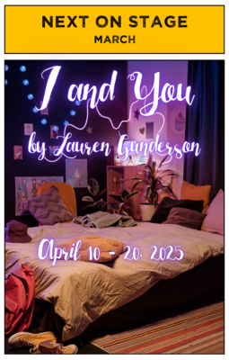 An unmade bed in a room decorated with string lights and colorful drawings.