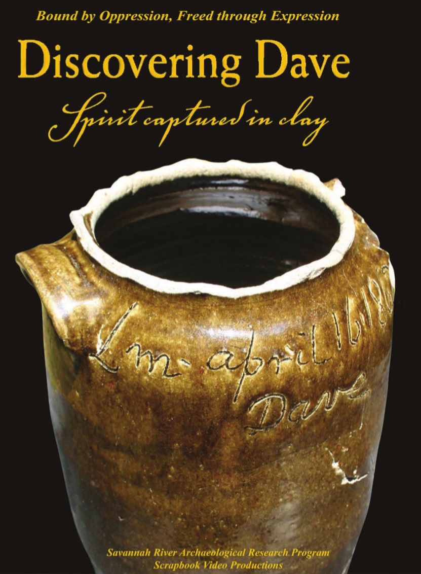 A hand made clay pot signed by the artist, known as Dave the Potter.