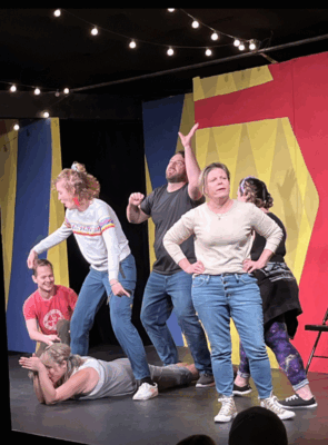 6 actors onstage in an improvisational scene.