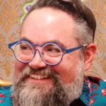 Color headshot of Charles Clary