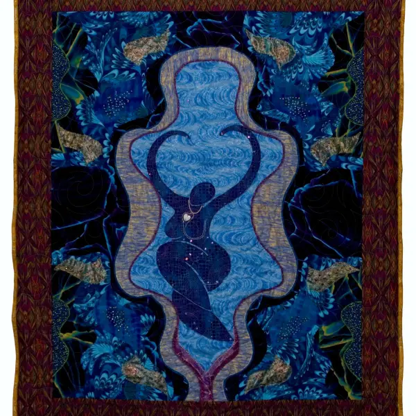 Quilted artwork featuring a dark blue female figure with arms curving overhead in a central opening.