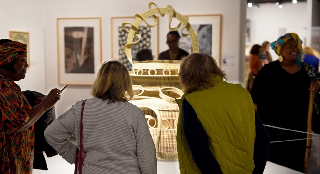 Female guests study Big Percy in the State Museum gallery.