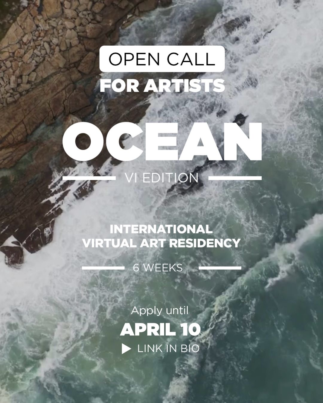 Overhead view of ocean waves on a rocky shore.