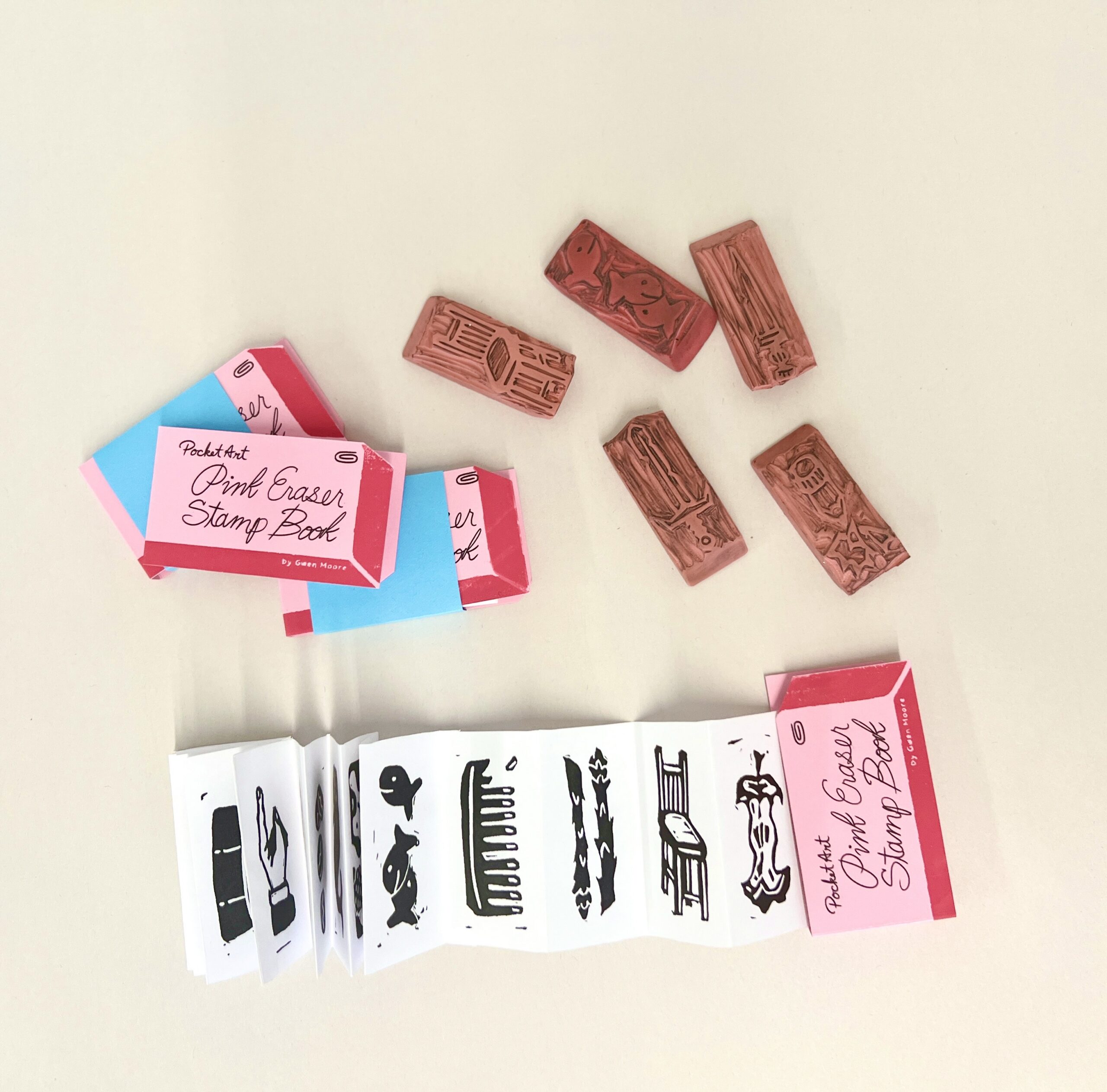 Pink erasers are carved with images to create ink stamps.