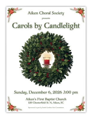 An evergreen wreath with red berries, with a red glass candle in the center.