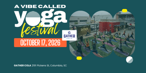 About 20 people take an outdoor yoga class.